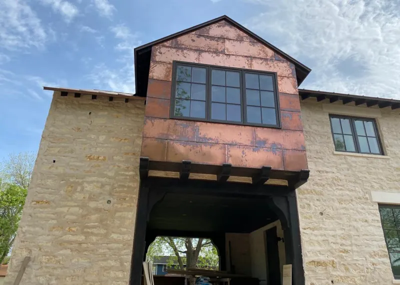 Copper metal panel facade on a stone building for Metal Roof Coating in West Valley City